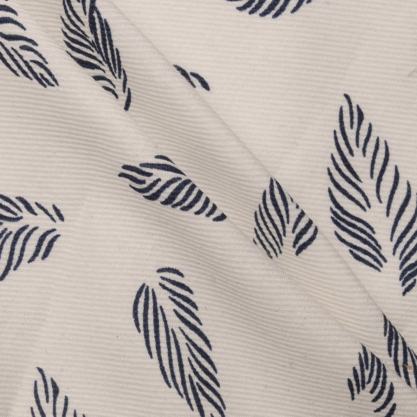 pattern of blue leaves on white fabric