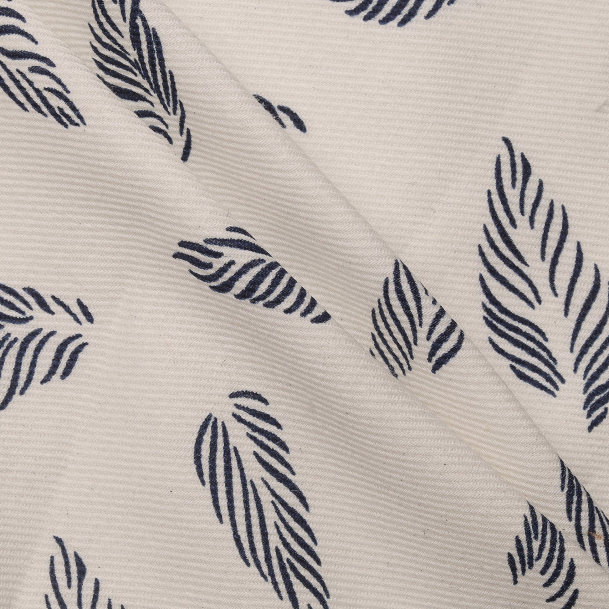 pattern of blue leaves on white fabric
